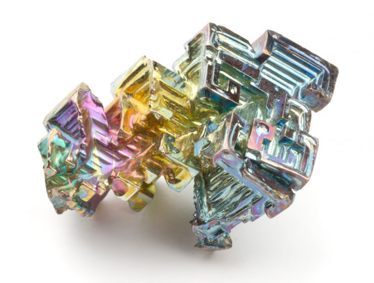 A picture of a cool shiny rock with multiple different colors. The rock is crystalized bismuth.